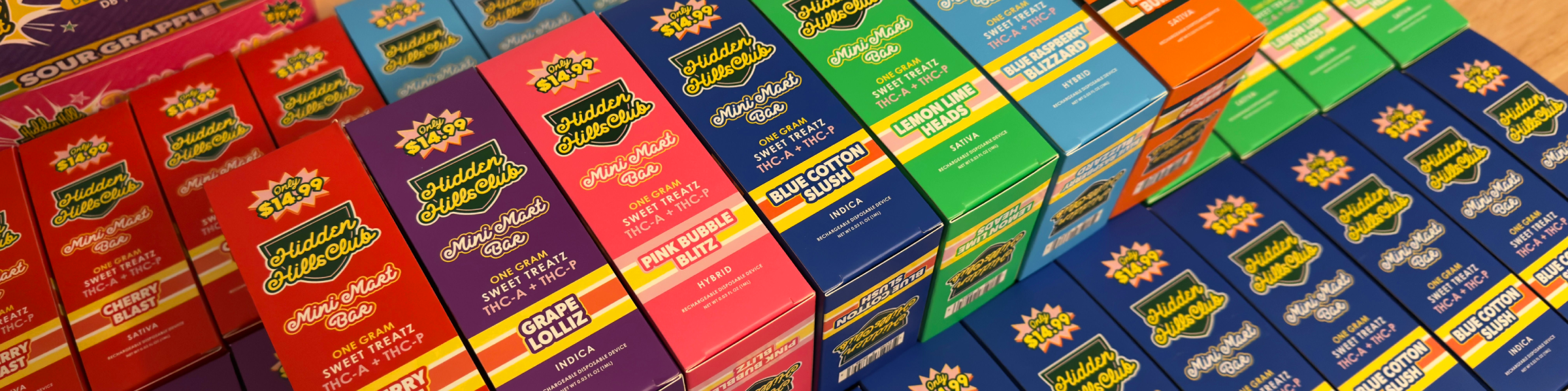 Close-up of Hidden Hills Sweet Treatz Mini Mart Bar disposable vape boxes in assorted flavors.