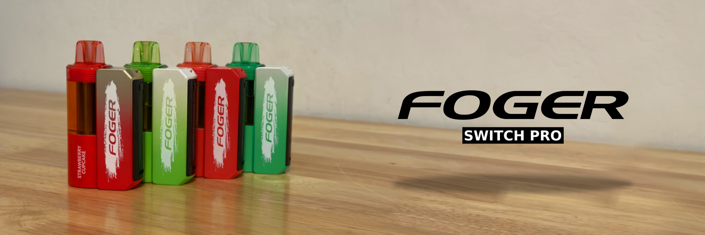 Foger Switch Pro disposable vapes lineup displayed on a wooden table in multiple flavors.